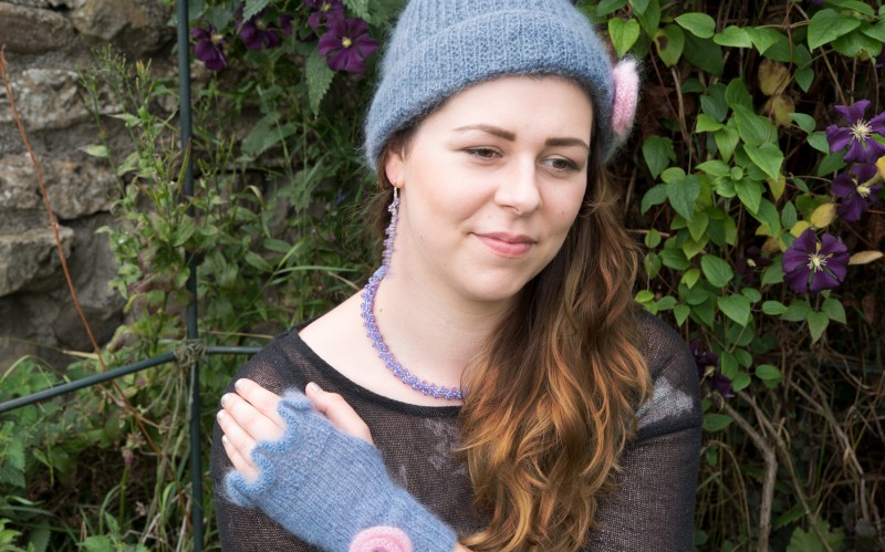 Model wearing hat and gloves