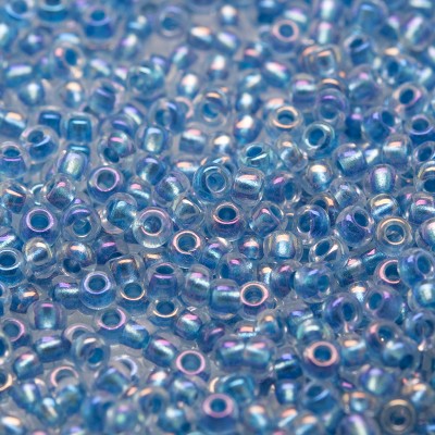 Preciosa Czech glass seed bead 11/0 Clear glass Blue metallic lined with a rainbow coating