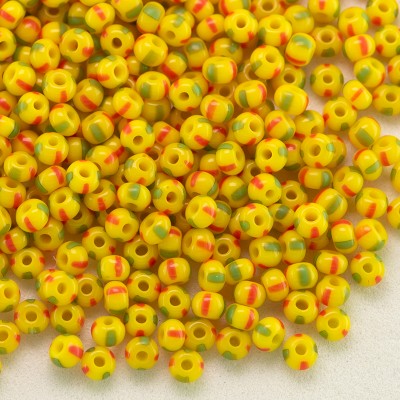 Preciosa Czech glass seed bead 11/0 Opaque yellow with Red & Green pinstripe