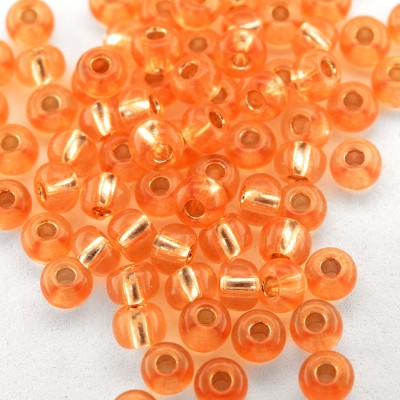 Preciosa Czech glass seed bead, size 5/0 Tangerine silver Lined