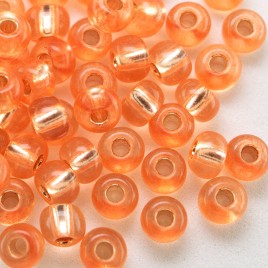 Preciosa Czech glass seed bead, size 5/0 Tangerine silver Lined